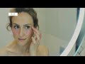 Woman with cat and skincare products supporting pet rescue